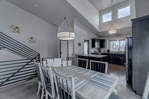 a kitchen and dining room with a table and chairs at Executive Golf Course Home, Family Friendly in Rapid City