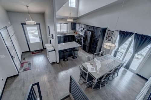 an overhead view of a kitchen with a table and chairs at Executive Golf Course Home, Family Friendly in Rapid City