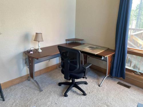 an office with a desk and a chair and a desk and a window at Black Hills Nature Retreat, Centrally Located in Keystone