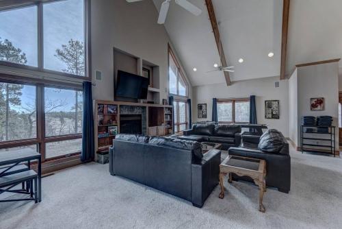 a large living room with couches and a tv at Black Hills Nature Retreat, Centrally Located in Keystone
