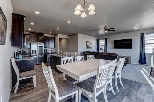 a kitchen and dining room with a table and chairs at Highly Accessible, Executive Style, Amazing View in Rapid City