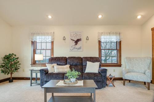 a living room with a couch and a table at 4 Mi to the Amish Village Spacious Home with Deck! in Ronks