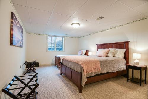 a bedroom with a large bed and a window at 4 Mi to the Amish Village Spacious Home with Deck! in Ronks