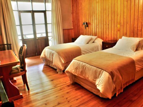 Postel nebo postele na pokoji v ubytování Mitico Puelo Lodge