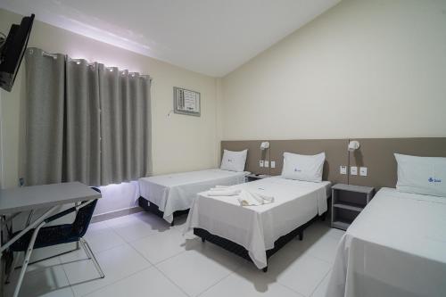 Katil atau katil-katil dalam bilik di Hotel Pousada do Farol