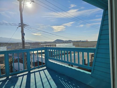 a view from the balcony of a house at Jeju Nova Pension in Jeju
