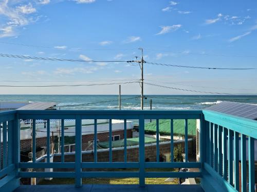 a view of the ocean from the balcony at Jeju Nova Pension in Jeju