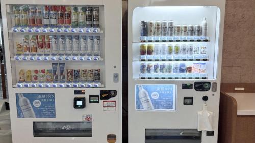 a vending machine filled with drinks and drinks at Toyoko Inn Yokohama Tsurumi eki Higashi guchi in Yokohama