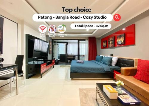 a living room with a bed and a tv at Patong - Studio Condo - Absolute Bangla Unit in Patong Beach