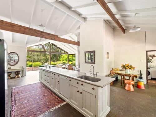 an open kitchen with a large sink and a living room at Shawlilly Stay in Margaret River Town