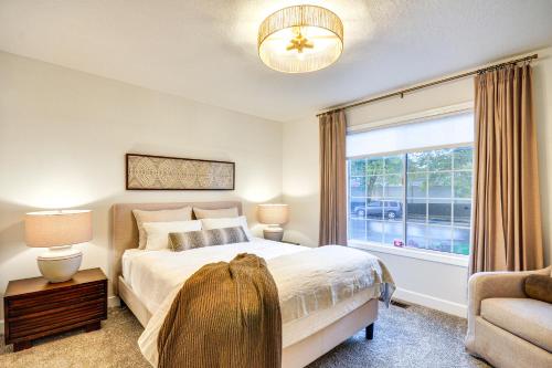 a bedroom with a large bed and a window at Near Shops and Cafes Beaverton Haven with Luxe Decor! in Beaverton