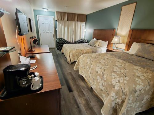 Ένα ή περισσότερα κρεβάτια σε δωμάτιο στο Hotel-Motel Drummond