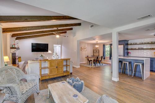 a living room with a couch and a table at Waterfront Retreat with Hot Tub in Gun Barrel City! in Gun Barrel City