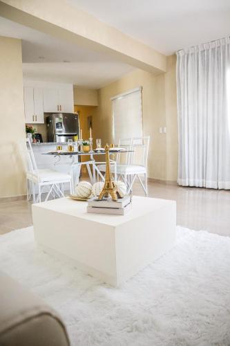 a living room with a white coffee table at Residencial Nany in San Felipe de Puerto Plata