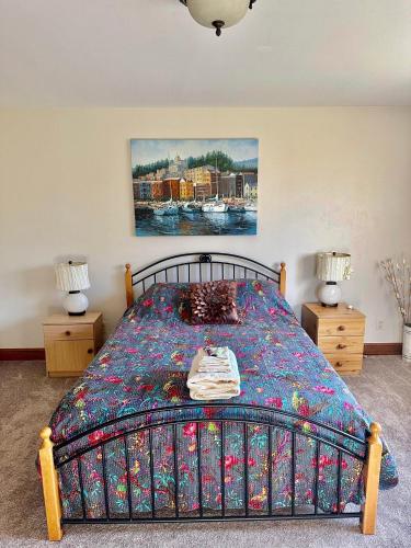a bedroom with a bed with a colorful bedspread at Affordable Luxury Mansion in Quincy