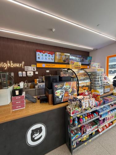 a fast food counter in a store with food at Troika Kota Bharu by Tasra Homestay with Free CarPark ACCEPT MALAYSIAN ONLY in Kota Bharu