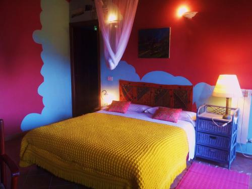 B&B Il Pioppo E La Fonteにあるベッド