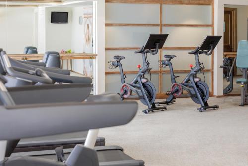 a row of exercise bikes in a gym at Pullman Reef Hotel Casino in Cairns
