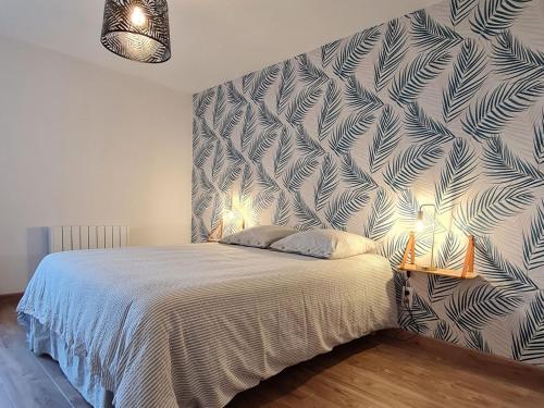 a bedroom with a bed with a blue and white wall at Gîte confortable à Athienville - FR-1-584-359 in Athienville