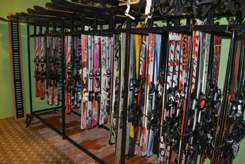 a bunch of skis are lined up on a rack at Snowflake Dag Hotel & SPA in Sarıkamıs