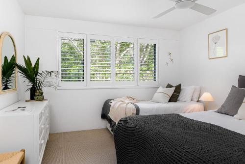 Ένα ή περισσότερα κρεβάτια σε δωμάτιο στο Apartment 2 Surfside