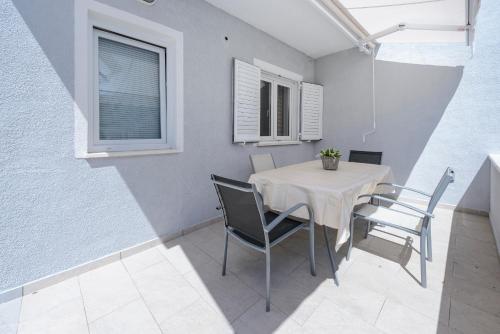 a dining room with a table and chairs at Villa Bingo in Cavtat
