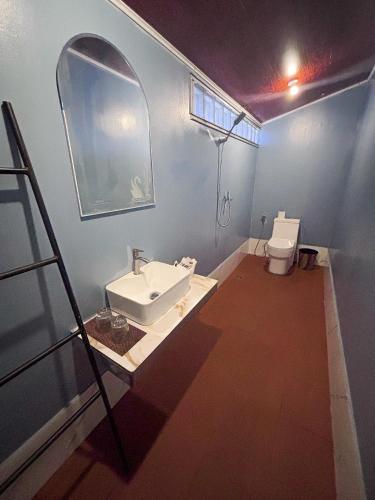 a bathroom with a sink and a toilet at CORAL in Koh Rong Sanloem