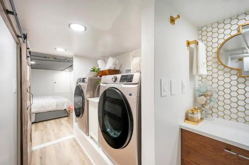 a kitchen with a washer and dryer in a trailer at Romantic Hideout 1Bedroom Lower Level in Stamford