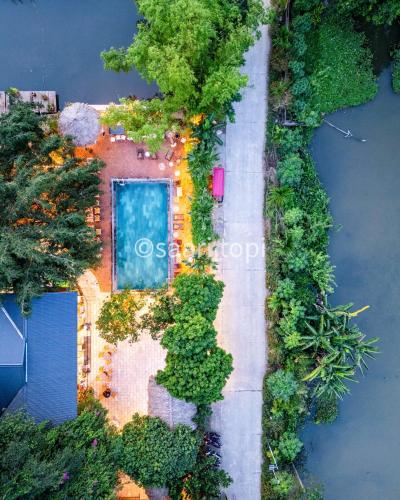 an aerial view of a house with a swimming pool at Tam Coc Central Bungalow-Hostel in Vũ Lâm