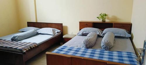 Ένα ή περισσότερα κρεβάτια σε δωμάτιο στο D'Pari Homestay Magelang