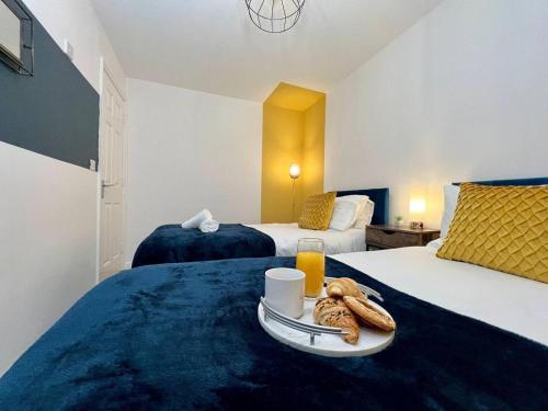 Ένα ή περισσότερα κρεβάτια σε δωμάτιο στο Contractor 4 Bed, Sleeps 7 Long Stay Discount