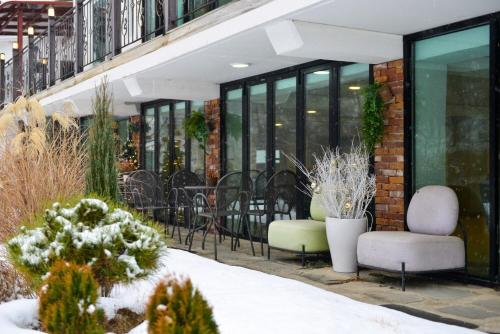 a building with chairs and tables and windows at Haneulbit gwangang nongwon in Chuncheon