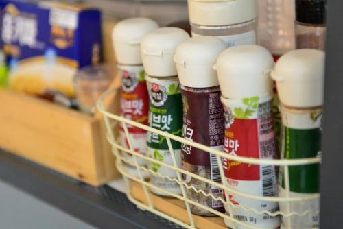 a shelf filled with lots of condiments at Haneulbit gwangang nongwon in Chuncheon
