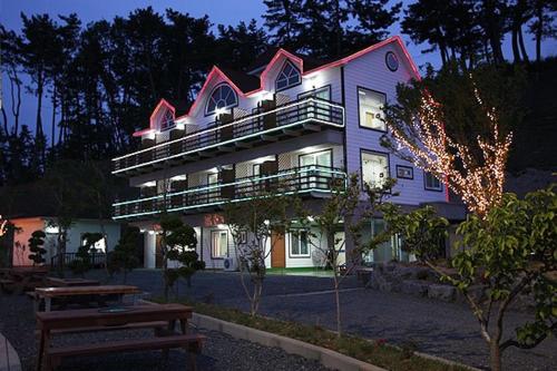 a large building with a bench in front of it at Blue Heights in Boryeong