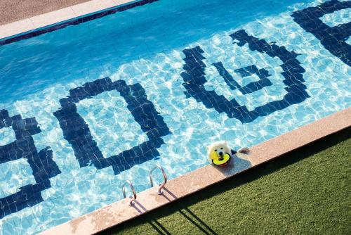 a swimming pool with a toy in the water at Gapyeong Bobo Dog Pool Villa in Gapyeong