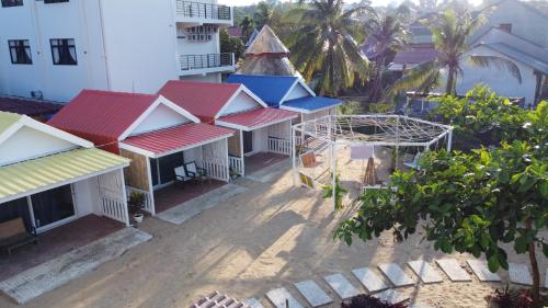 an overhead view of a building with red and blue roofs at CORAL in Koh Rong Sanloem
