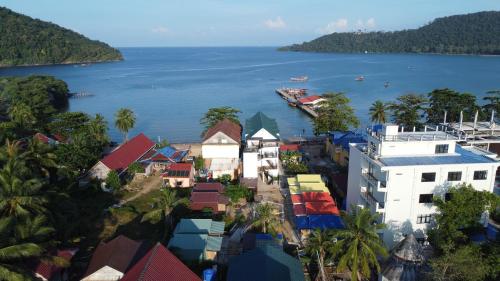 an aerial view of a town next to a body of water at CORAL in Koh Rong Sanloem