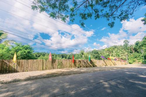 a fence on the side of a road at Busai Dream Falls Resort in Loboc