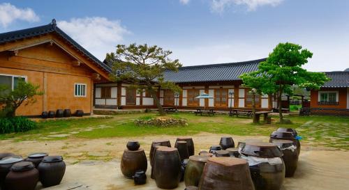 a group of pots sitting in front of a building at Buan Dream of Butterfly Pension in Buan