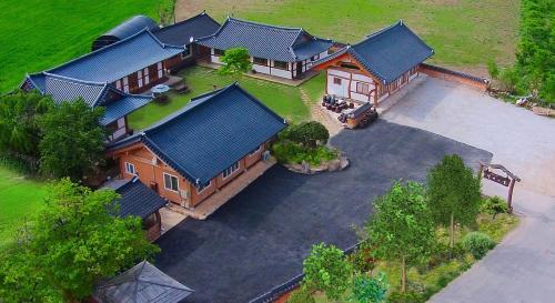 an overhead view of a large house with a yard at Buan Dream of Butterfly Pension in Buan
