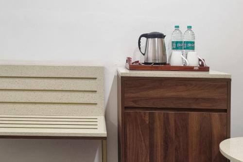 a counter with two drawers and two bottles of water at Labh Garh Palace Resort & Spa in Udaipur