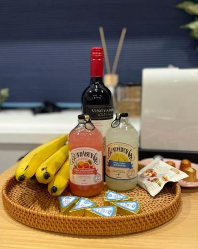a basket with two bottles of alcohol and bananas on a table at Byeoldul Private Pension in Jeonju