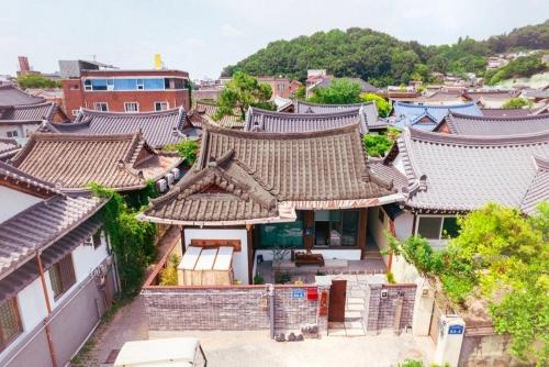 an overhead view of a building with roofs at Happiness on Jacuzzi Private Pension in Jeonju