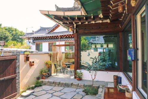 an outside view of a house with a patio at Happiness on Jacuzzi Private Pension in Jeonju