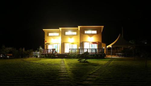 a large building with lights on in front of it at night at Yeongwol Dongghang Story in Yeongwol