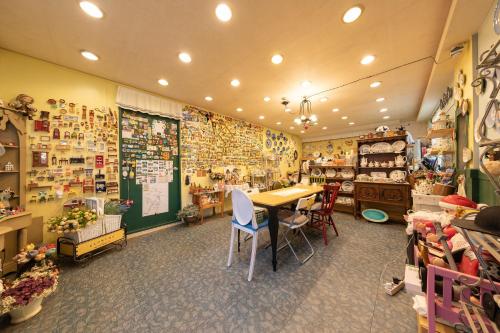 a room with a table and chairs in a store at Gapyeong Morning Calm Pension in Gapyeong