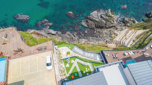 an aerial view of the ocean from a building at Samcheok Laon Spa Pension in Samcheok