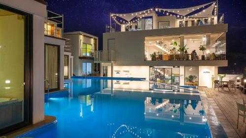 a house with a swimming pool at night at Uljin sanpoli Pension in Uljin