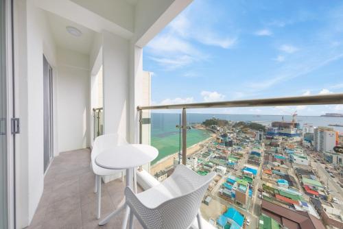 a balcony with a view of a city at Sokcho Rianvichae Central in Sokcho