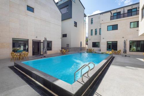 a large swimming pool in the middle of a building at Gangneung Stay in Gangneung in Gangneung
